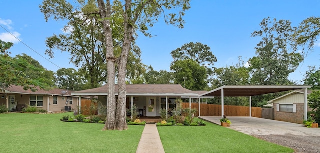 ranch-style house with cooling unit, a porch, and a front lawn