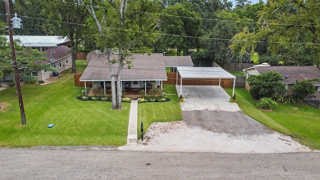 view of front of home with a garage and a front lawn