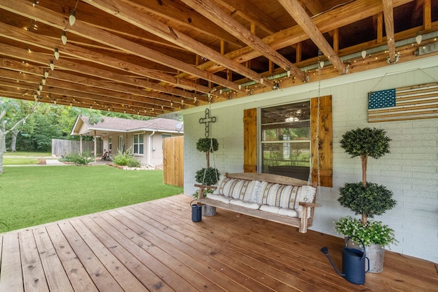 wooden deck with a lawn