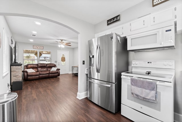 kitchen featuring dark wood-type flooring, ceiling fan, white appliances, and white cabinetry