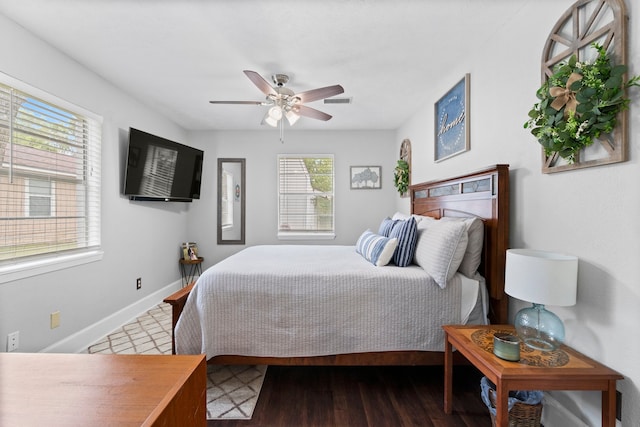 bedroom featuring ceiling fan and dark hardwood / wood-style floors