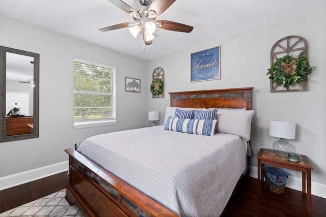 bedroom featuring ceiling fan and dark hardwood / wood-style floors