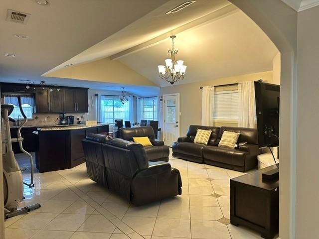 7410 Ashmole Ln, Houston, TX 77088 - living area with a chandelier, light tile patterned flooring, and arched walkways