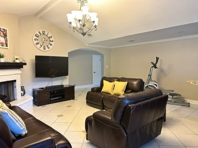 tiled living room with a fireplace, lofted ceiling with beams, ornamental molding, and a notable chandelier