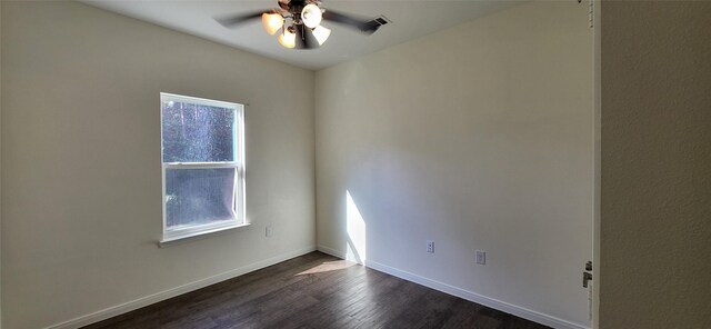 unfurnished room with dark wood finished floors, plenty of natural light, ceiling fan, and baseboards