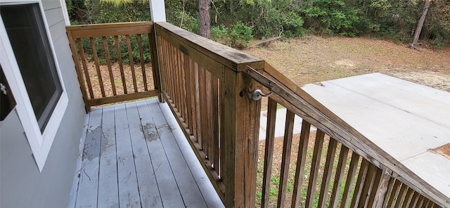 wooden deck with a patio area