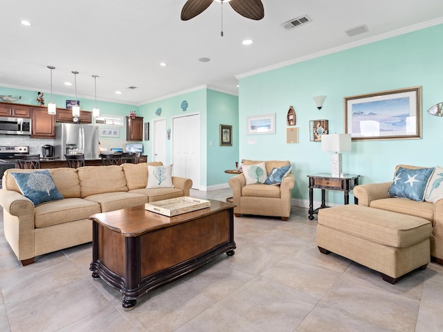 living room with ceiling fan and crown molding