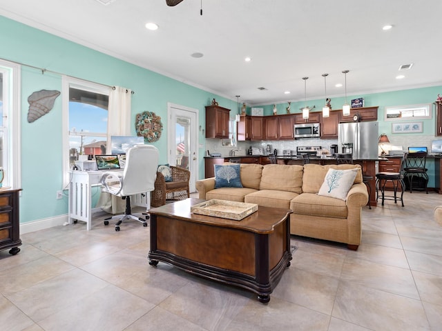 tiled living room with ceiling fan and crown molding