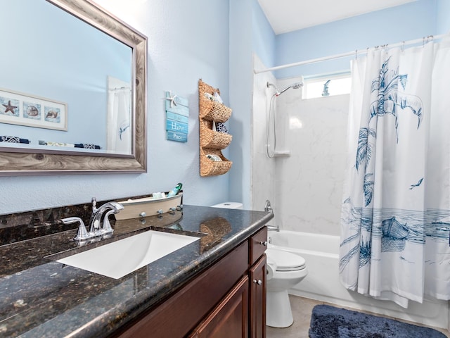 full bathroom with vanity, toilet, and shower / tub combo