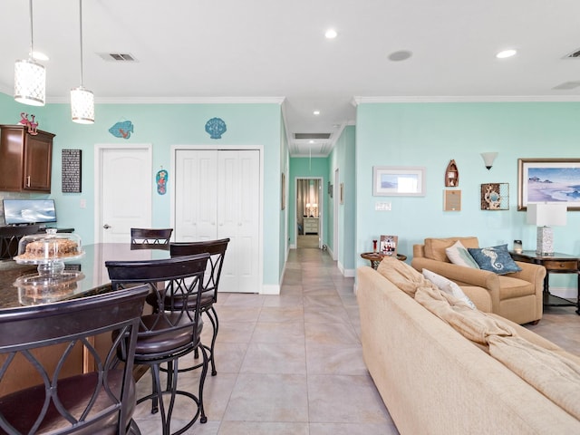 living room with light tile patterned floors and crown molding