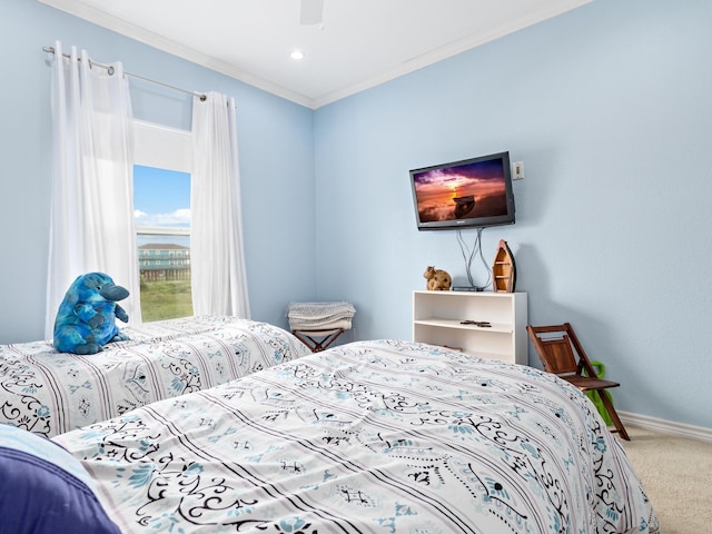 bedroom featuring carpet flooring, ceiling fan, and ornamental molding