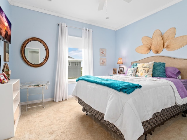 bedroom featuring ceiling fan, light carpet, and ornamental molding