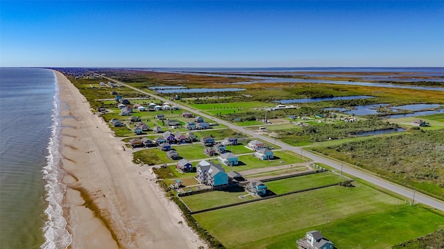 aerial view featuring a water view and a view of the beach