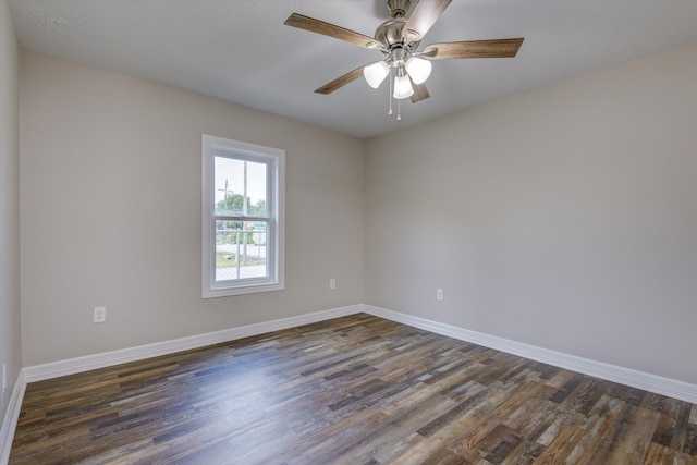 empty room with dark wood-type flooring and ceiling fan