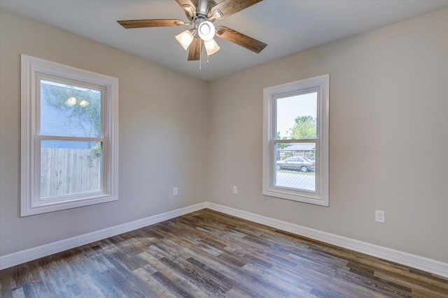 unfurnished room featuring ceiling fan and dark hardwood / wood-style flooring