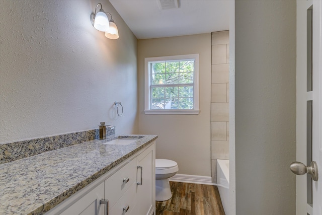 full bathroom with shower with separate bathtub, hardwood / wood-style flooring, vanity, and toilet