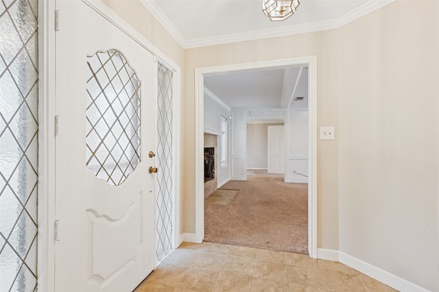 hall featuring ornamental molding and light colored carpet