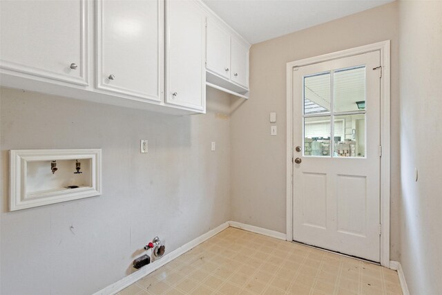 laundry area with hookup for a washing machine, cabinets, and hookup for a gas dryer