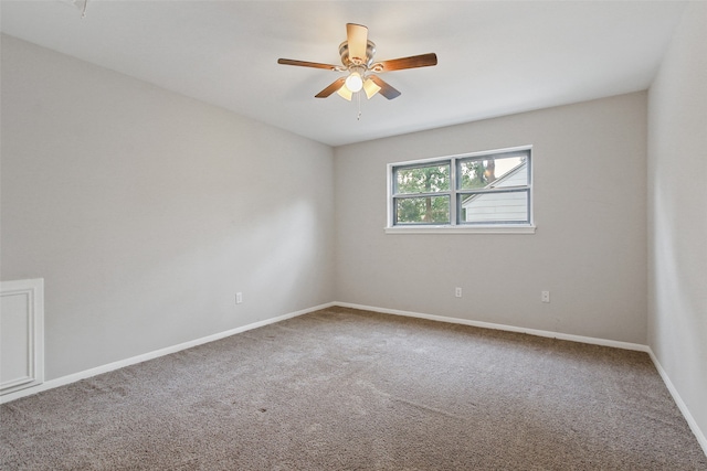 empty room featuring ceiling fan and carpet flooring