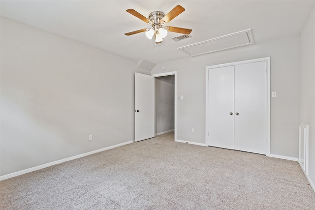 unfurnished bedroom featuring a closet, ceiling fan, and light carpet