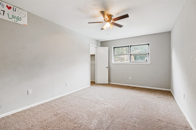 interior space featuring ceiling fan and light carpet