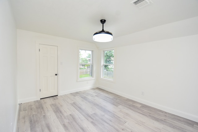 unfurnished room featuring light hardwood / wood-style floors