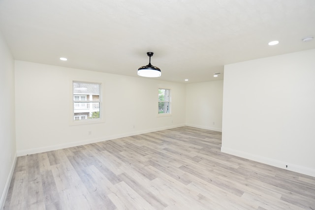 unfurnished room featuring light hardwood / wood-style floors