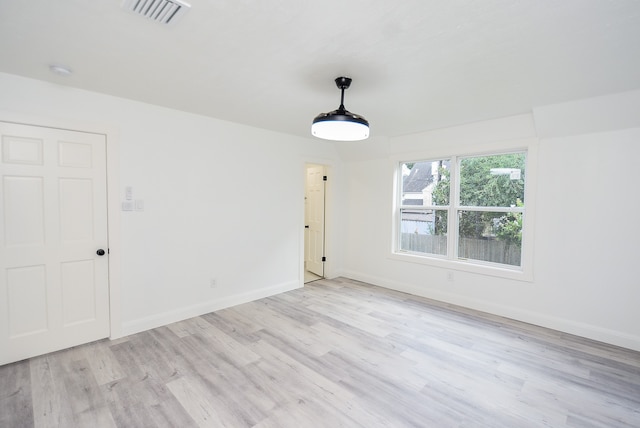 spare room with light wood-type flooring