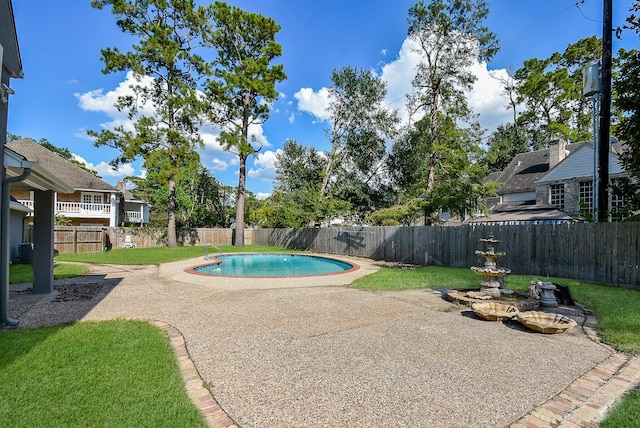 view of pool with a yard, a patio, and central air condition unit