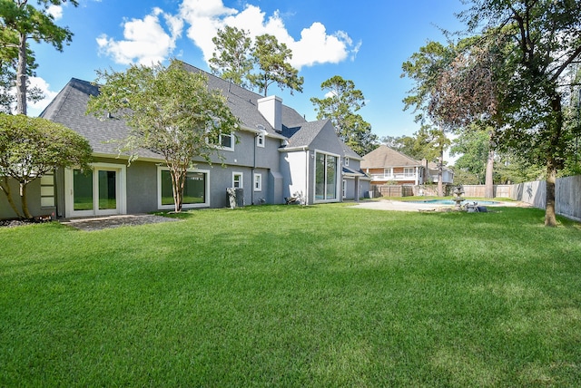 view of yard with a fenced in pool and a patio area