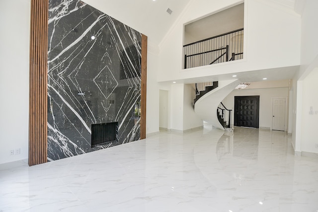 living room with high vaulted ceiling and a fireplace