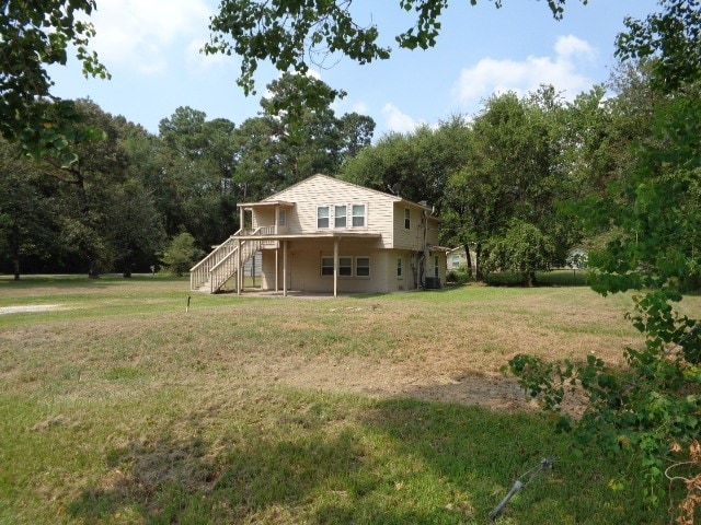 view of home's exterior with a lawn