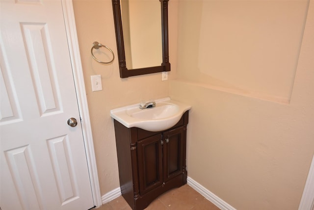 bathroom featuring tile patterned floors, vanity, and baseboards