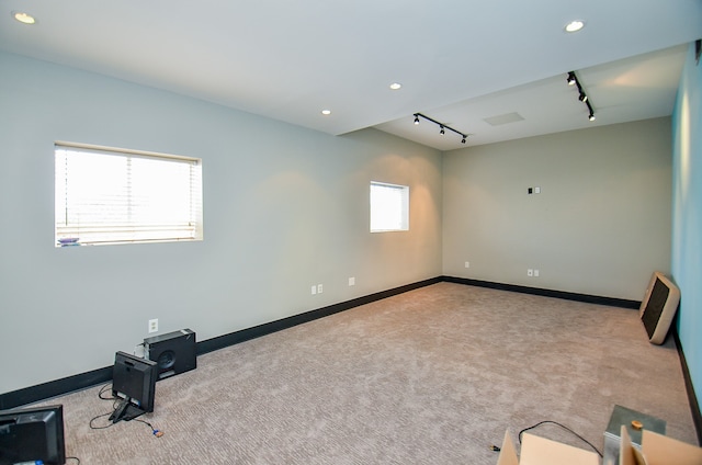 interior space with track lighting and plenty of natural light