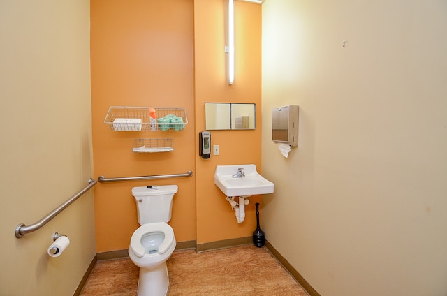 bathroom featuring toilet and sink