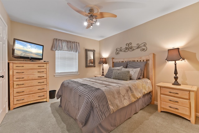 carpeted bedroom with ceiling fan