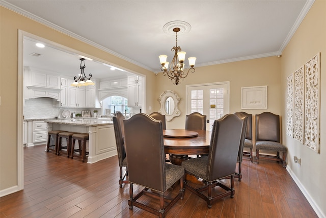 dining room with dark hardwood / wood-style floors, crown molding, and a healthy amount of sunlight