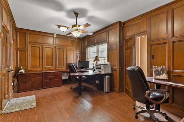 office space with ceiling fan and dark hardwood / wood-style flooring