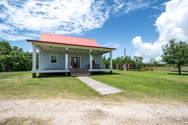 view of front of house featuring a front yard and a porch