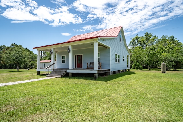 view of front of house with a front lawn and covered porch