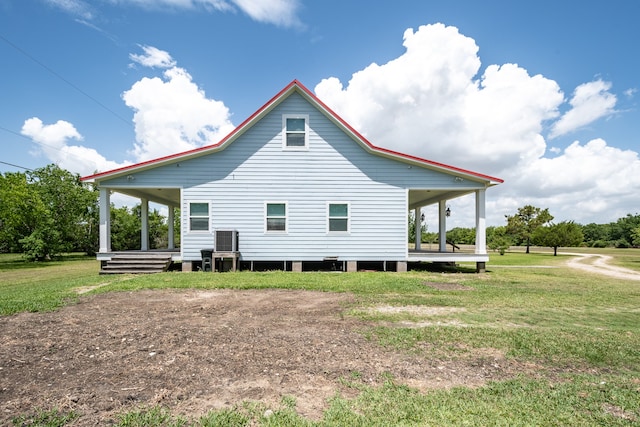 view of side of property featuring a lawn and central AC unit