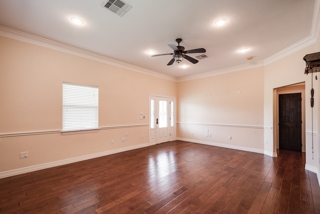 spare room with ceiling fan, dark wood-type flooring, and crown molding