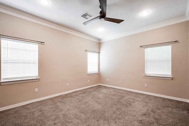 unfurnished room with carpet floors, ornamental molding, and ceiling fan