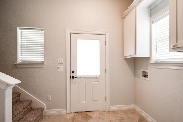 interior space with light tile patterned flooring and plenty of natural light