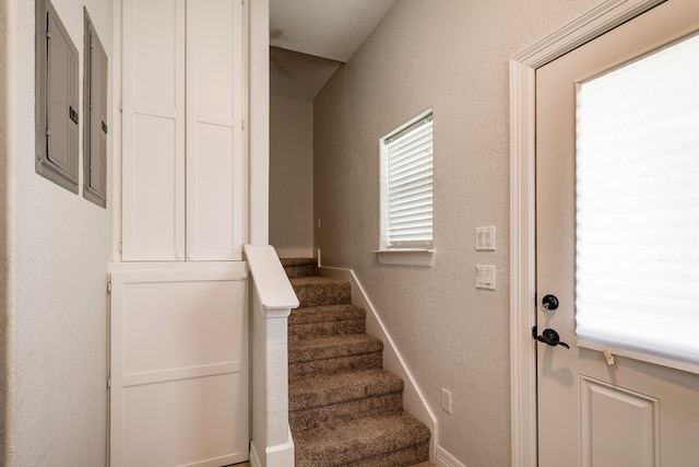 stairway featuring electric panel