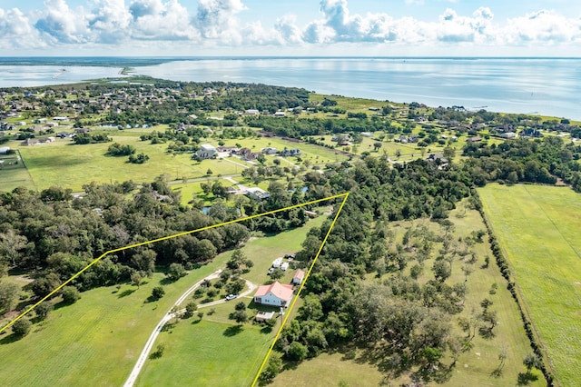 drone / aerial view featuring a rural view and a water view