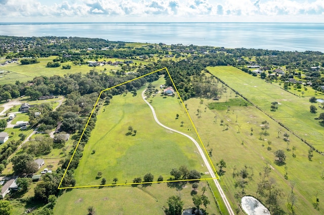 aerial view with a water view and a rural view