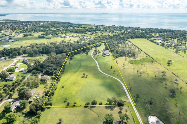 aerial view with a water view and a rural view