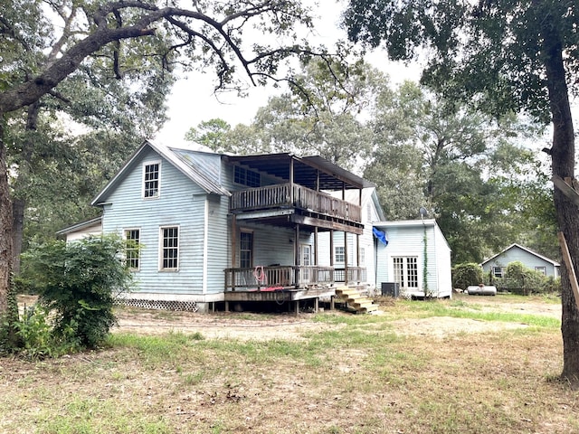 rear view of property with a deck