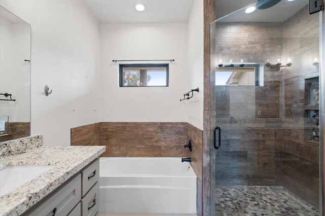 bathroom with plus walk in shower and vanity